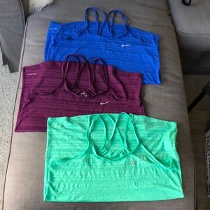 Three nike workout tops